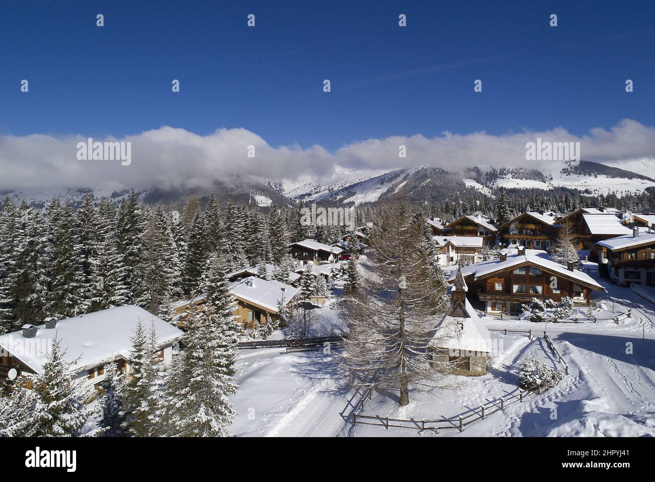 Mountain village houses covered with snow during winter Stock Photo - Alamy