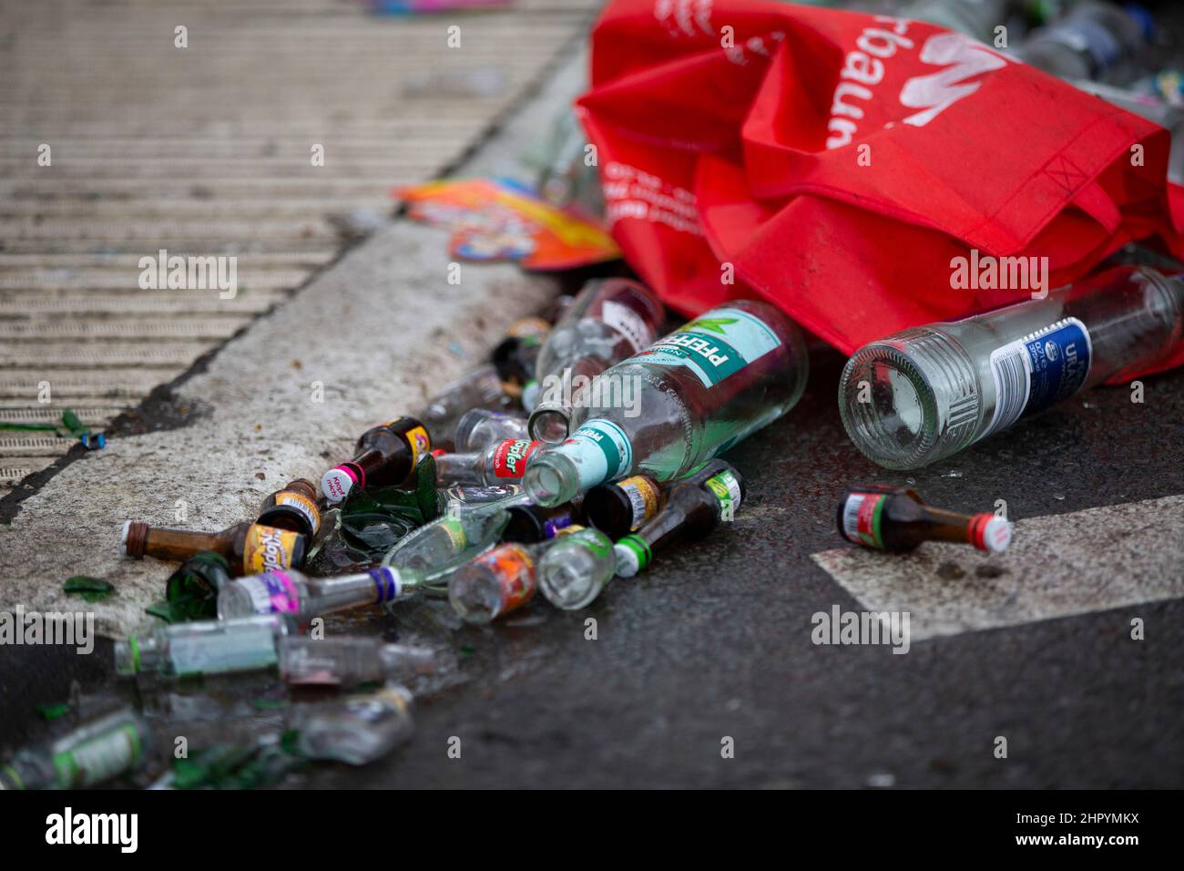 Cologne, Germany. 24th Feb, 2022. Empty alcohol bottles and alcopops lie on a side street of Zülpicher Strasse. In Cologne, only vaccinated fools with an additional negative test or booster vaccination are to be allowed to celebrate carnival. The entire city area is declared a 'customs zone'. As a result, the 2G-plus rule will apply throughout Cologne on Carnival days. Credit: Thomas Banneyer/dpa/Alamy Live News Stock Photo