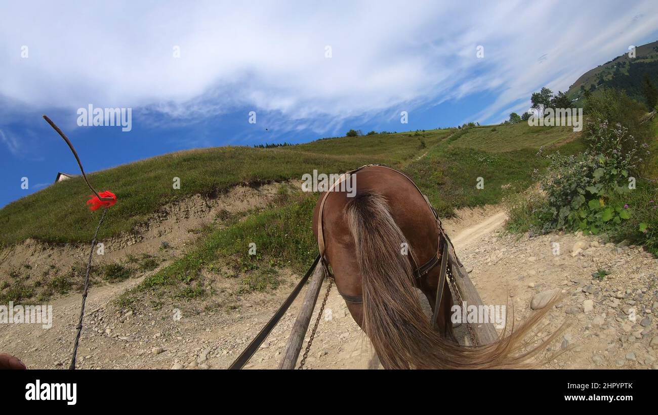 Mountains and road with horse wagon hires stock photography and images