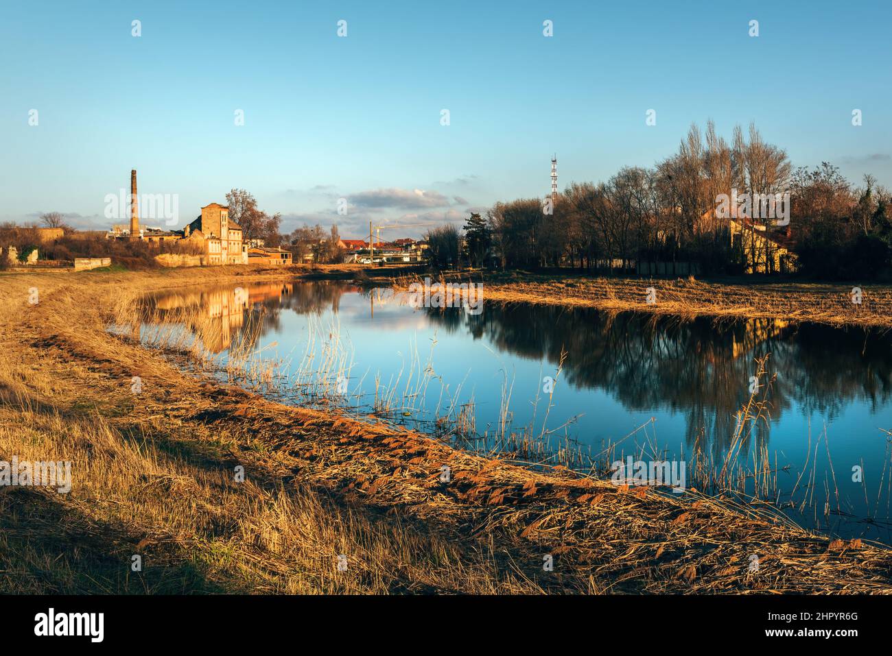 Begej still water in Town of Zrenjanin, Vojvodina province in Serbia. Autumn scenery landscape. Stock Photo