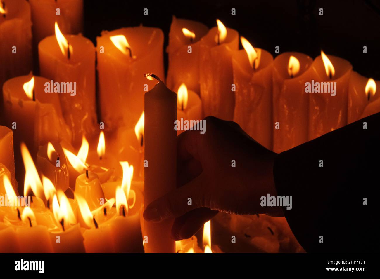 Lighting candles in chapel of Our Lady from the Kamenita vrata (Stone