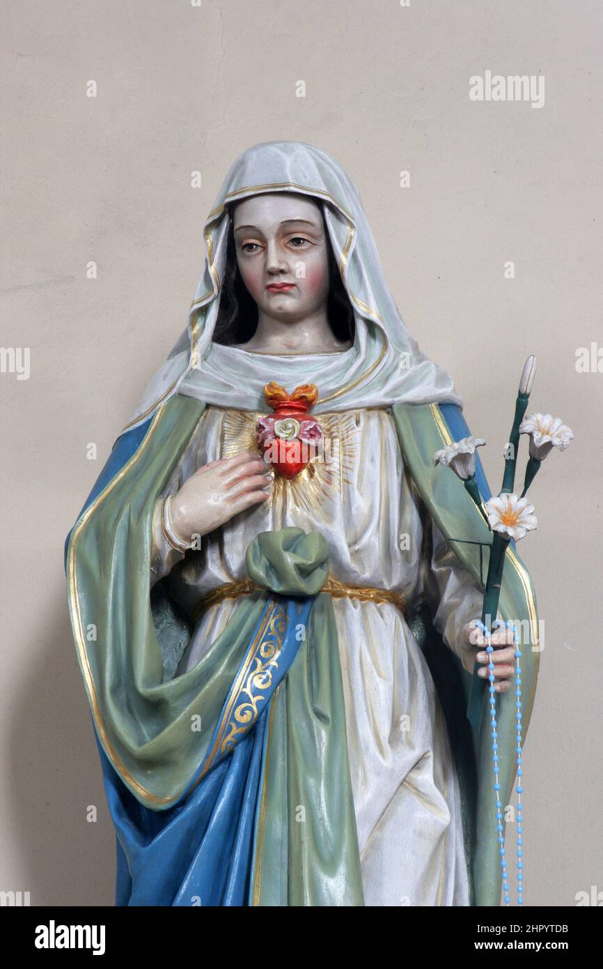 Immaculate Heart of Mary, statue on the altar of the Immaculate Heart of Mary in the parish church of St. Matthew in Garcin, Croatia Stock Photo