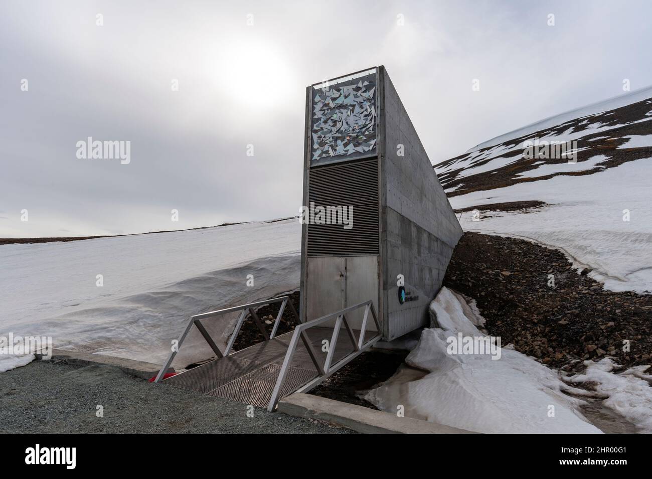 The entrance to the Svalbard Global Seed Vault built into a snow covered mountain. Longyearbyen, Spitsbergen Island, Svalbard, Norway. Stock Photo