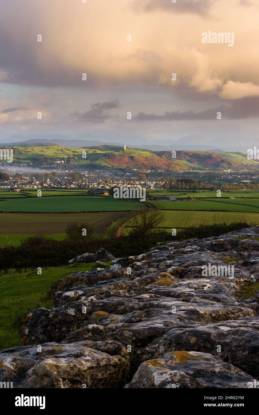 Ulverston, the hoad and Sir John Barrow monument captured at morning golden hour from Birkrigg Common Limestone Pavement, Ulverston, Cumbria, UK Stock Photo