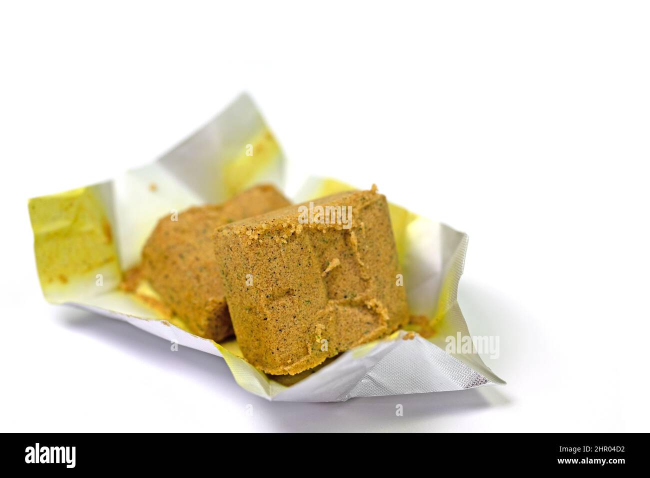 Vegetable bouillon, bouillon cubes isolated against white background
