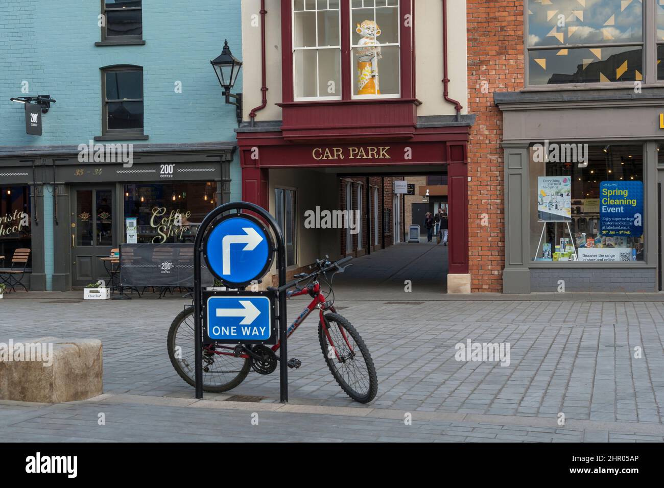 Bicycle parked against one way motor vehicle sign Sincil Street Lincoln city 2022 Stock Photo
