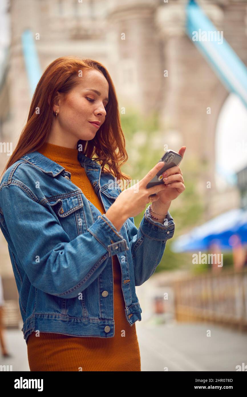 Female Vlogger Or Social Influencer Travelling Through London Using