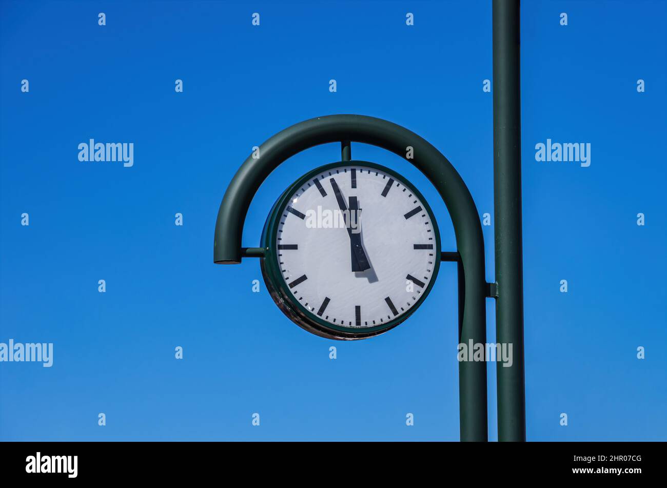 Almost 12, this clock no longer shows 5 to 12, but 3 to 12 instead. Stock Photo