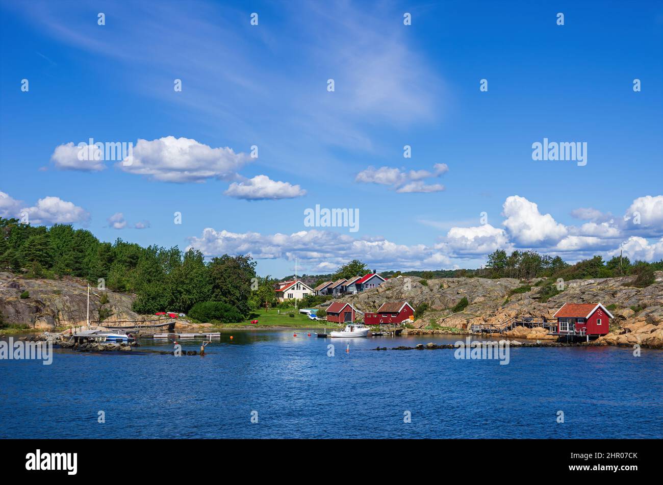 Strömstad, Bohuslän, Västra Götalands län, Sweden: Picturesque rocky coast with small settlement and marina on an offshore island. Stock Photo