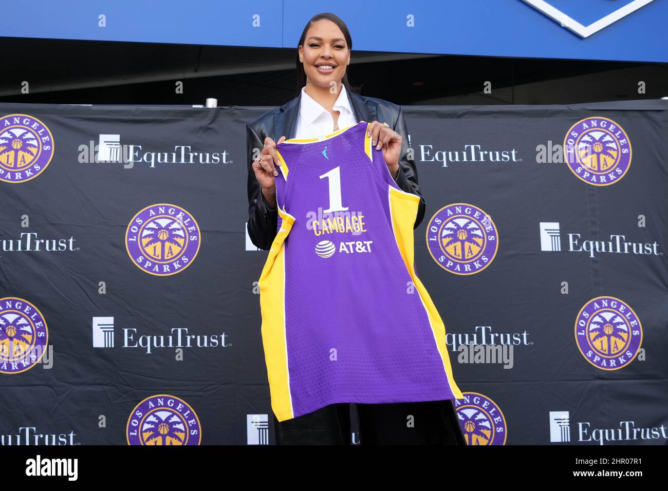 Liz Cambage poses with Los Angeles Sparks jersey during press