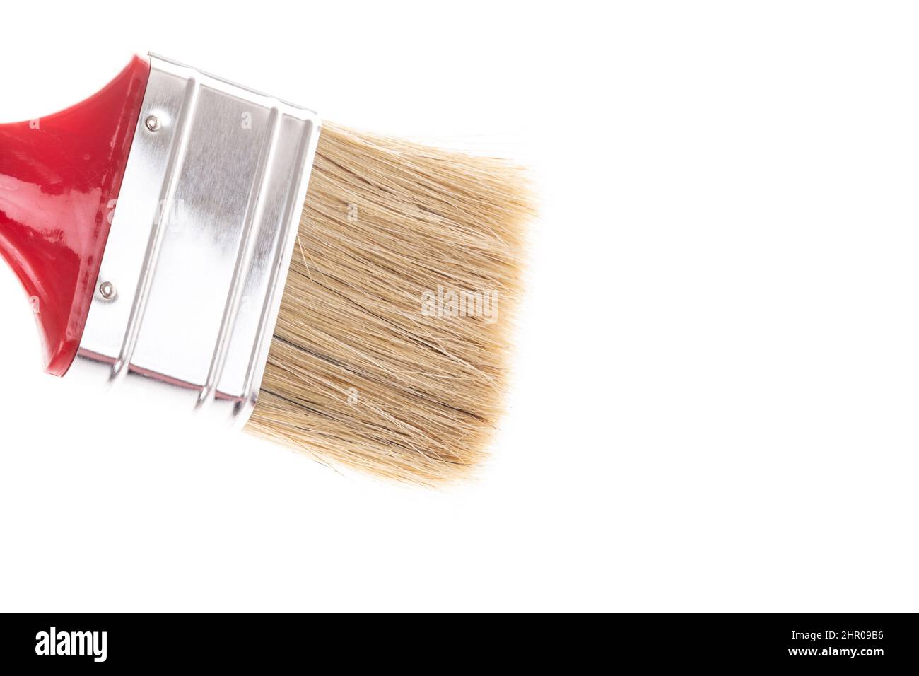paintbrush, profile view closeup red handle new and clean paint brush