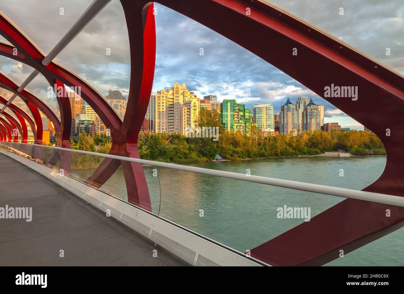 Calgary downtown seen through the structure of the Peace Bridge at Prince's Island Park, Alberta, Canada. Stock Photo