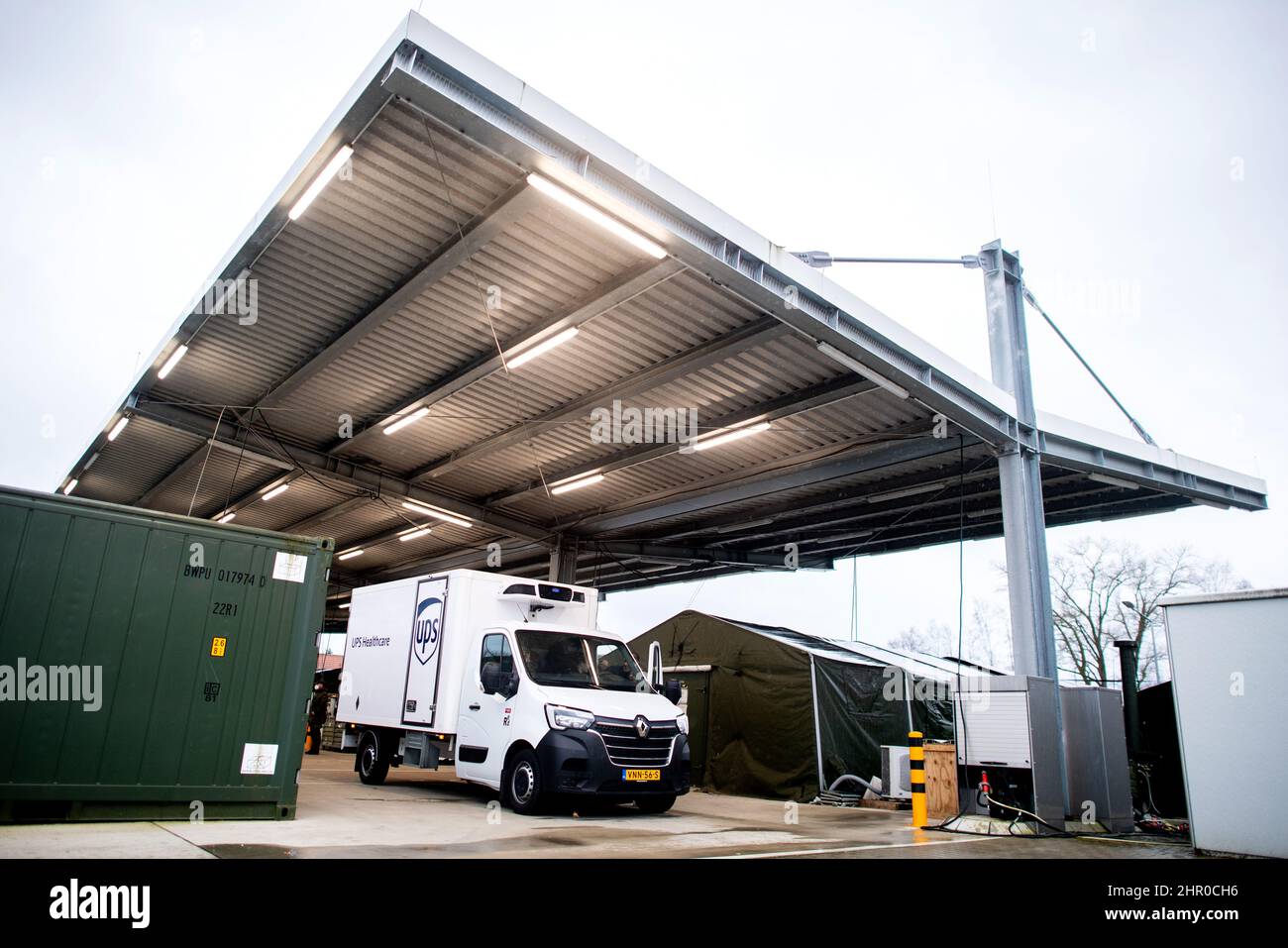 24 February 2022, Lower Saxony, Quakenbrück: A van delivers Novavax's Corona vaccine Nuvaxovid to the grounds of the Bundeswehr pharmacy, where it is temporarily stored in refrigerated containers. The barracks in Quakenbrück, Lower Saxony, serve as the central vaccine warehouse in Germany during the Corona crisis. Photo: Hauke-Christian Dittrich/dpa Stock Photo