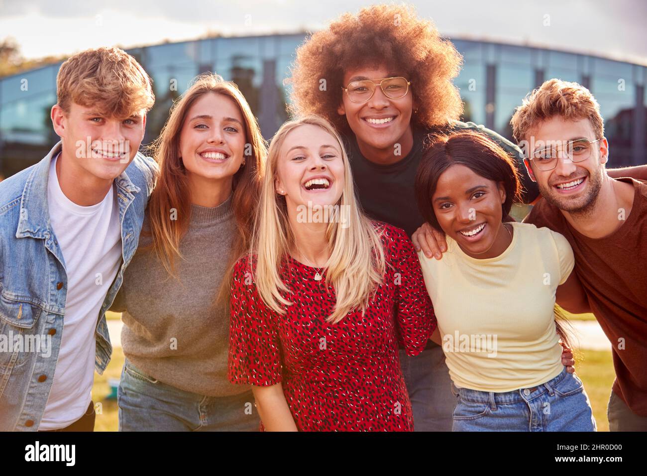 Group Of University Or College Students Outdoors On Campus Smiling And Looking At Camera Stock Photo