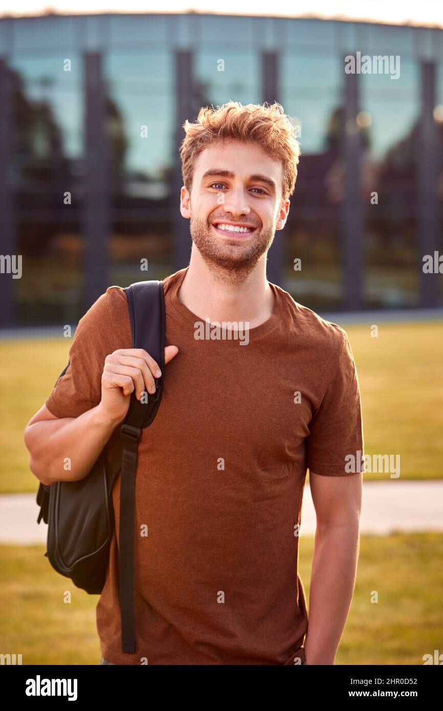 Portrait Of Male University Or College Student Standing Outdoors By ...
