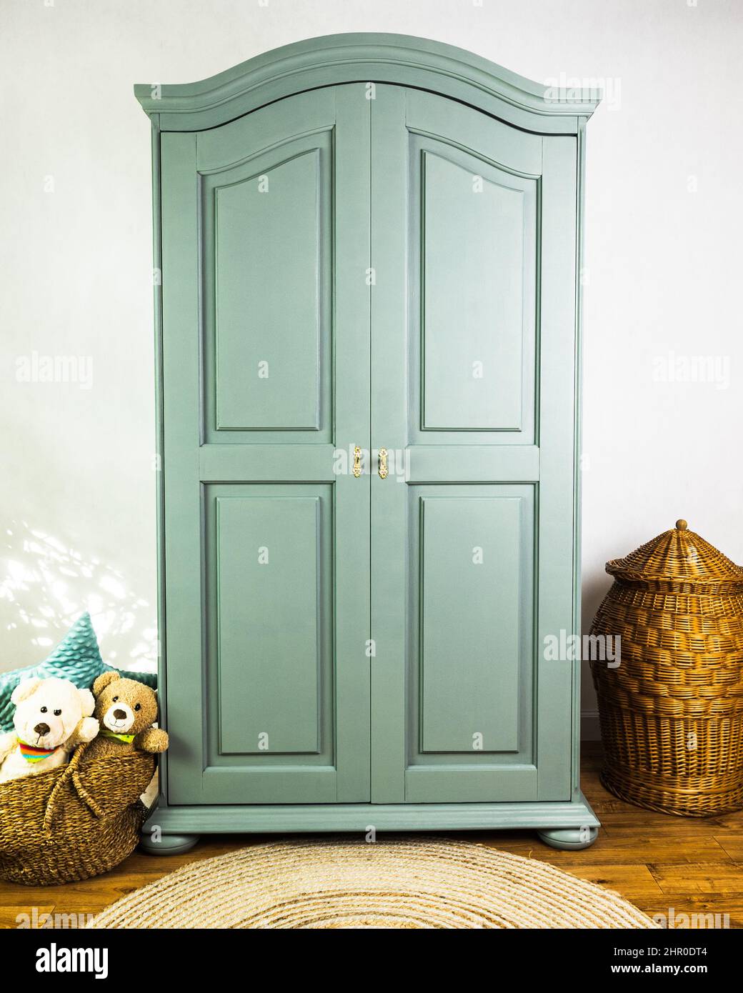 Old wardrobe after renovation painted in green beautiful deep color