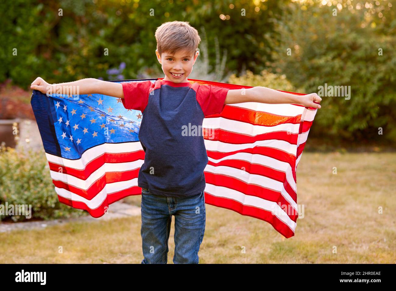 Boy holding american flag hi-res stock photography and images - Alamy