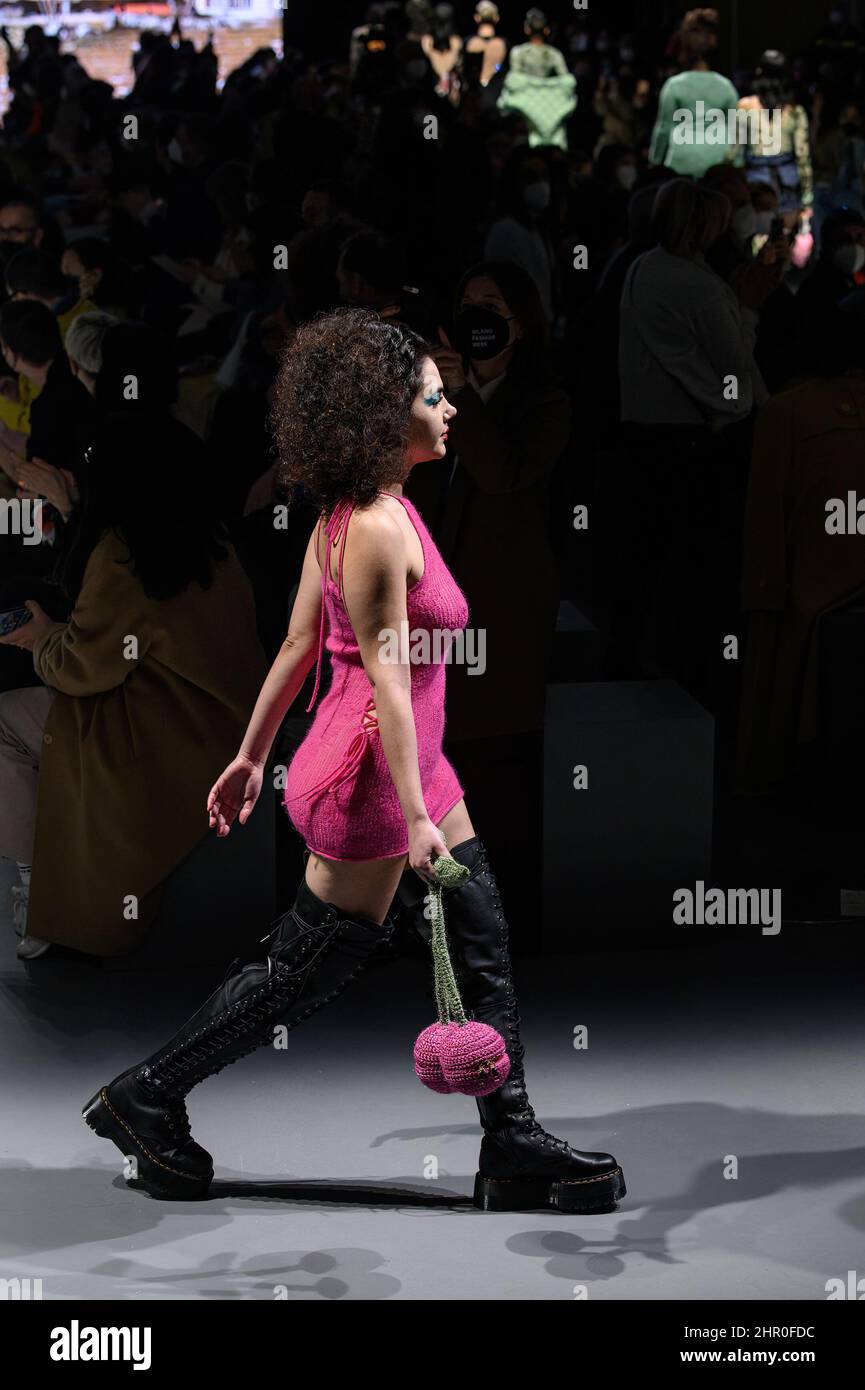A model with fucsia accessories walks during the fashion show. The Italian young designer Marco Rambaldi presented his collection for autumn and winter 2022/23 at Milan Fashion Week Fall-Winter 2022-2023. (Photo by Valeria Ferraro / SOPA Images/Sipa USA) Stock Photo