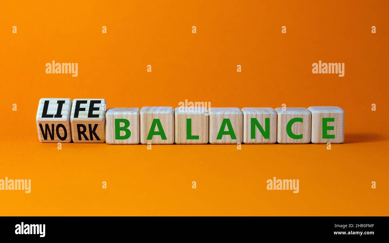 Work life balance symbol. Turned wooden cubes and changed concept words ...