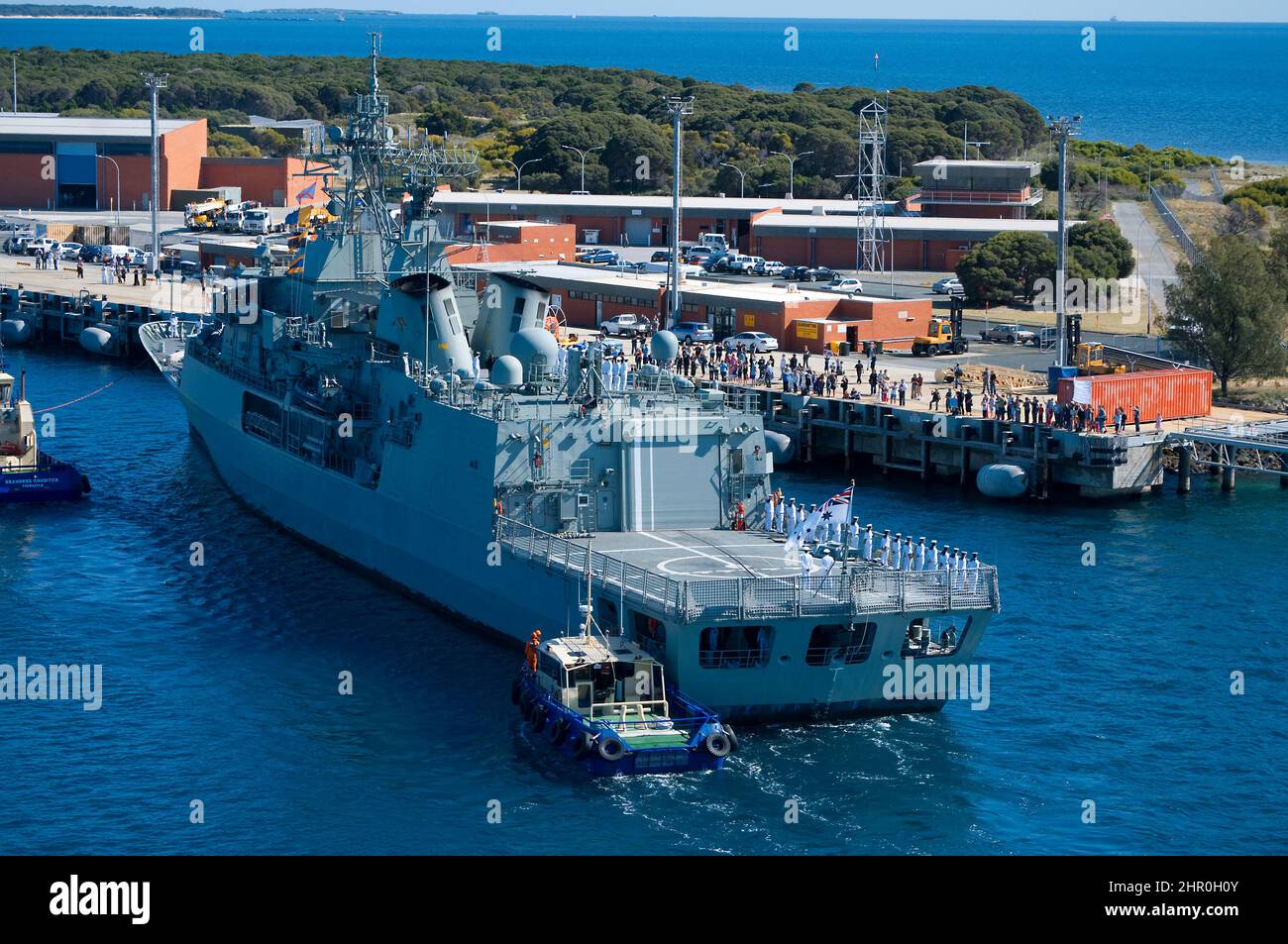 A Royal Australian Navy frigate berthing at Western Australia's Garden Island naval base, following an overseas deployment. Stock Photo