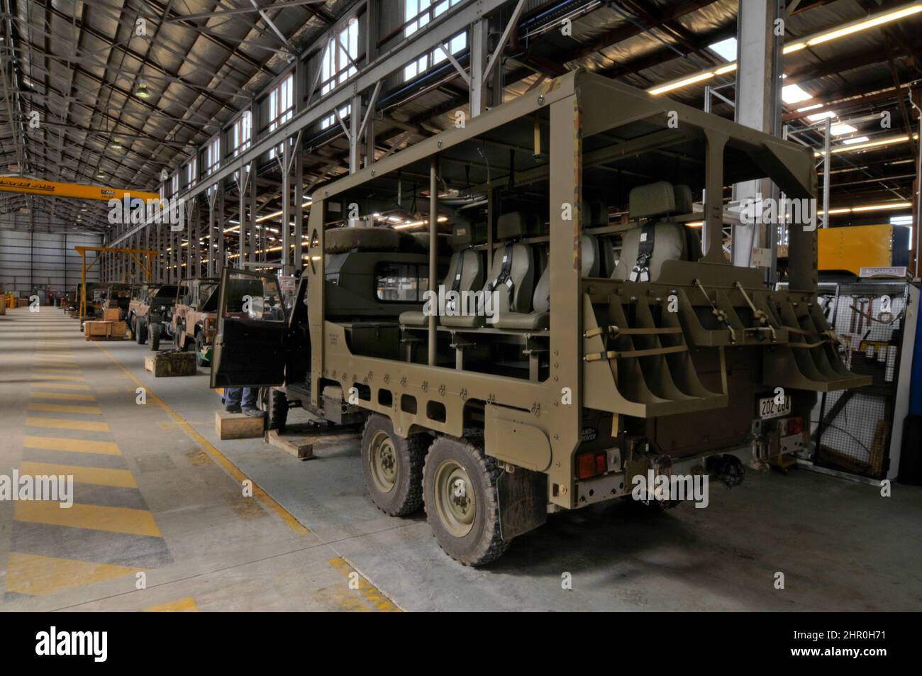 Military troop transport vehicles undergoing remanufacture and upgrading. Stock Photo
