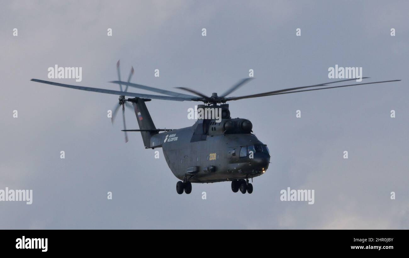 Moscow Russia AUGUST, 26, 2015 Mil Mi-26 Halo Soviet Russian military heavy transport helicopter in flight in the blue sky. Mil Mi-26 Halo is the largest and most powerful helicopter in the World. Stock Photo