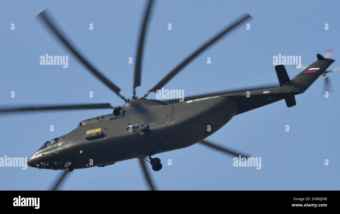 Moscow Russia AUGUST, 26, 2015 Mil Mi-26 Halo Soviet Russian military heavy transport helicopter in flight in the blue sky. Mil Mi-26 Halo is the largest and most powerful helicopter in the World. Stock Photo