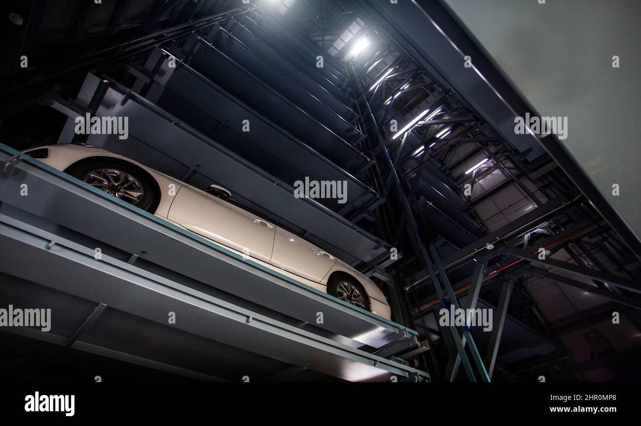 inside automated car parking system is a mechanical system designed to minimize the area with stack parking in building Stock Photo