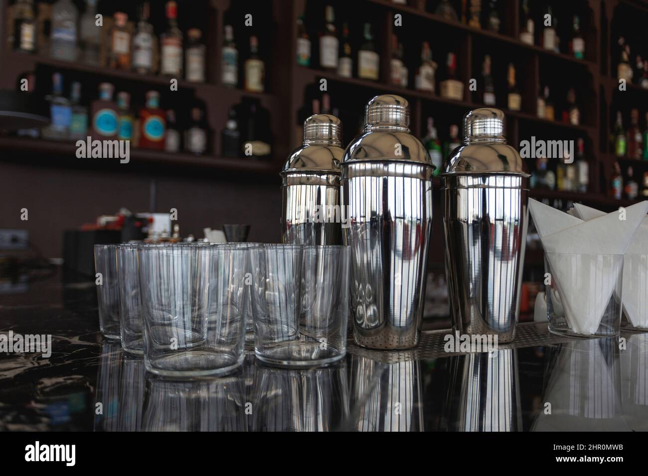 preparing shaker and clean glass for servig liquid water to customer on bar Stock Photo