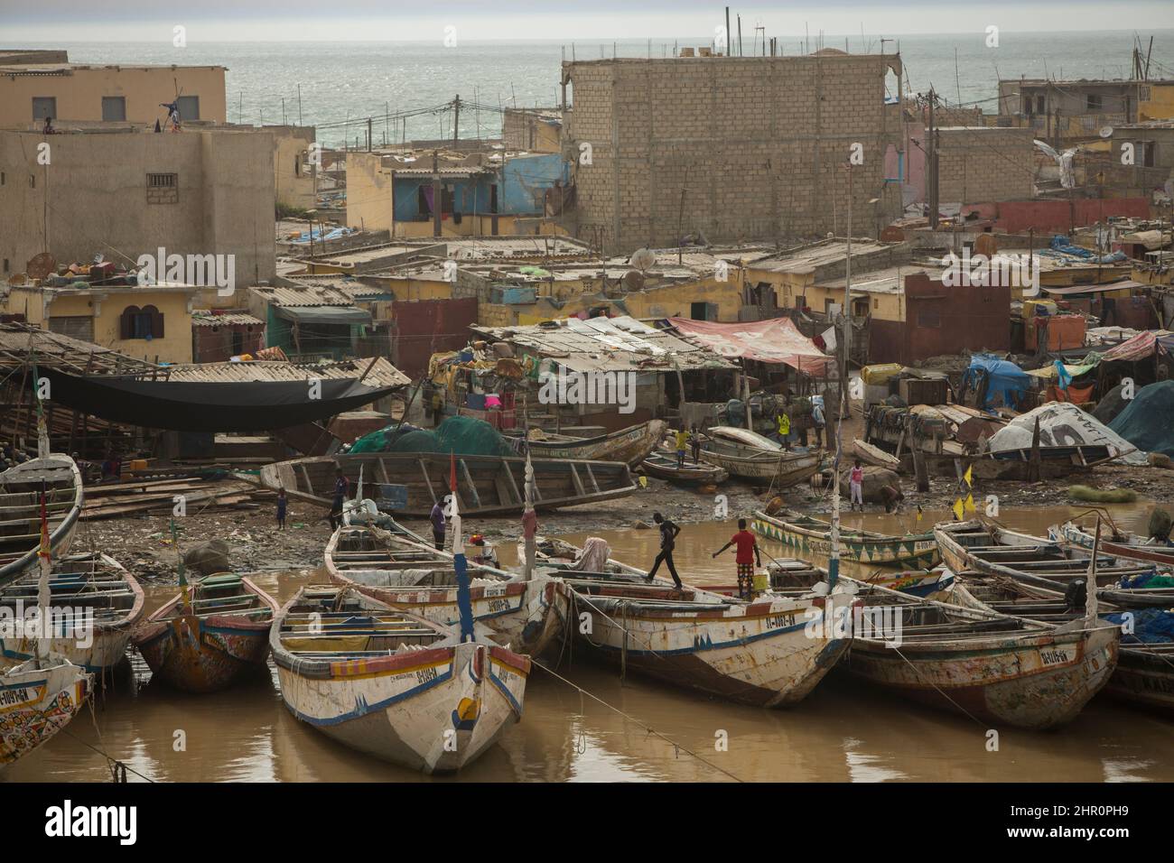 Pirogues dock along the coast of the Senegal River in Saint Louis, Senegal, West Africa. Stock Photo