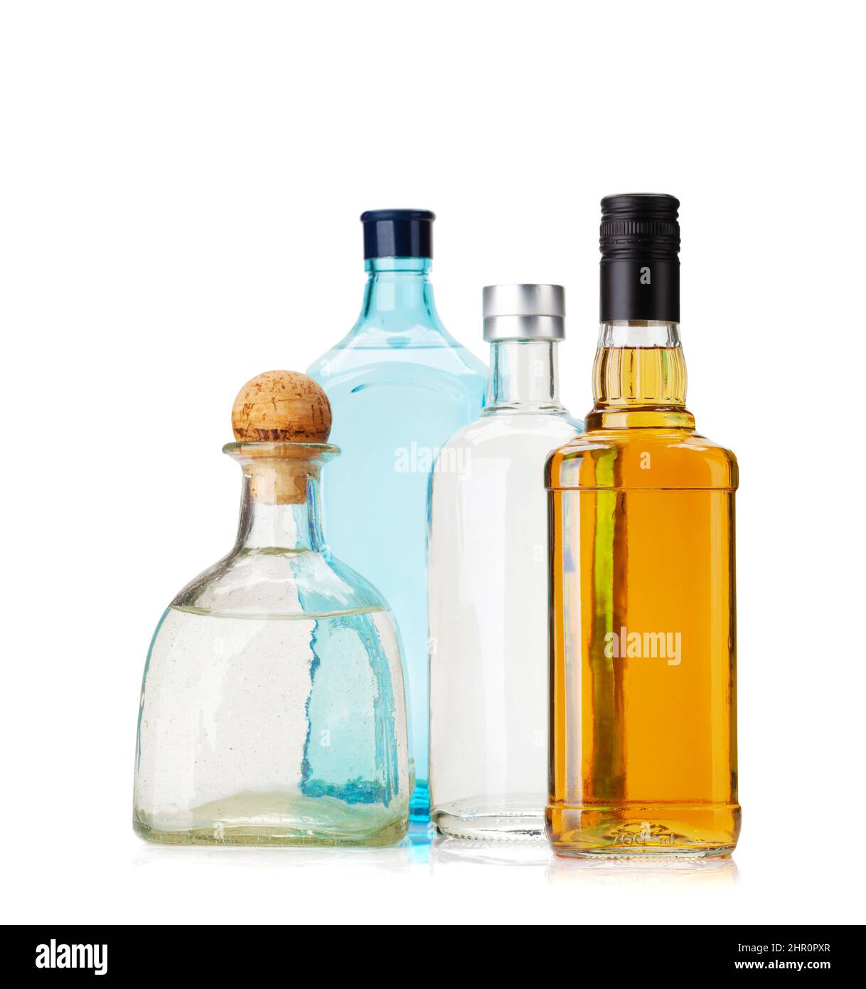 Various hard liquor bottles. Gin, vodka, tequila and whiskey. Isolated