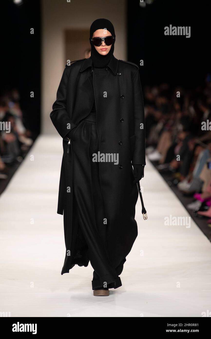 Milan, Italy. 24th Feb, 2022. A model walks on the runway at the Max Mara  fashion show during Fall Winter 2022 Collections Fashion Show at Milan  Fashion Week in Milan, Italy on