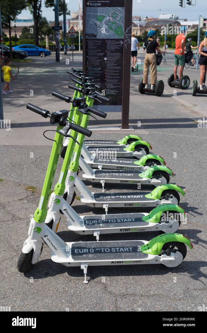 VIENNA, AUSTRIA - JULY 26, 2020: Row of electric Kiwiride scooters for rent in the center of the city.  Kiwiride is a transportation company running e Stock Photo