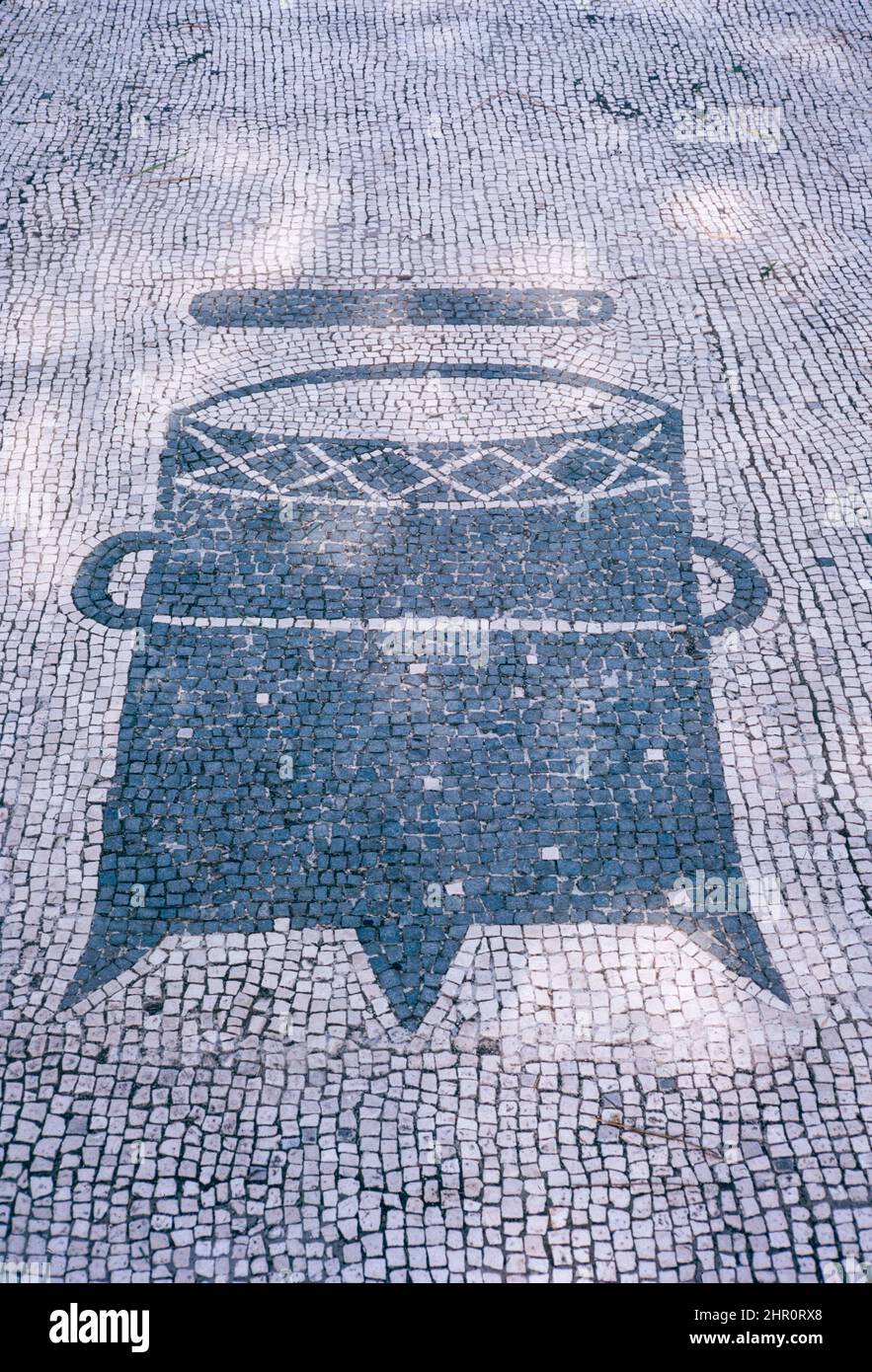 Ostia Antica - large archaeological site in progress, location of the harbour city of ancient Rome.  Piazzale delle Corporazioni (Square of the Corporations) mosaic.  Archival scan from a slide. April 1970. Stock Photo