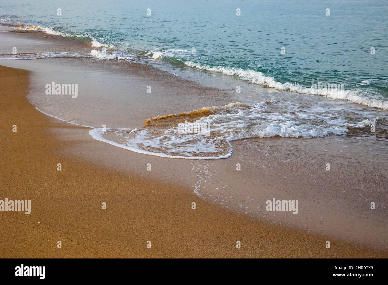 Beautiful waves on sandy beach hi-res stock photography and images - Alamy