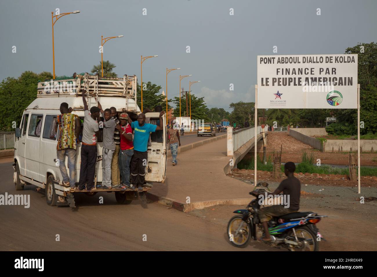 A sign reading “ Abdoul Diallo of Kolda Bridge Financed by the American People” stands at the side of the Kolda Bridge in Kolda Senegal, West Africa. Stock Photo