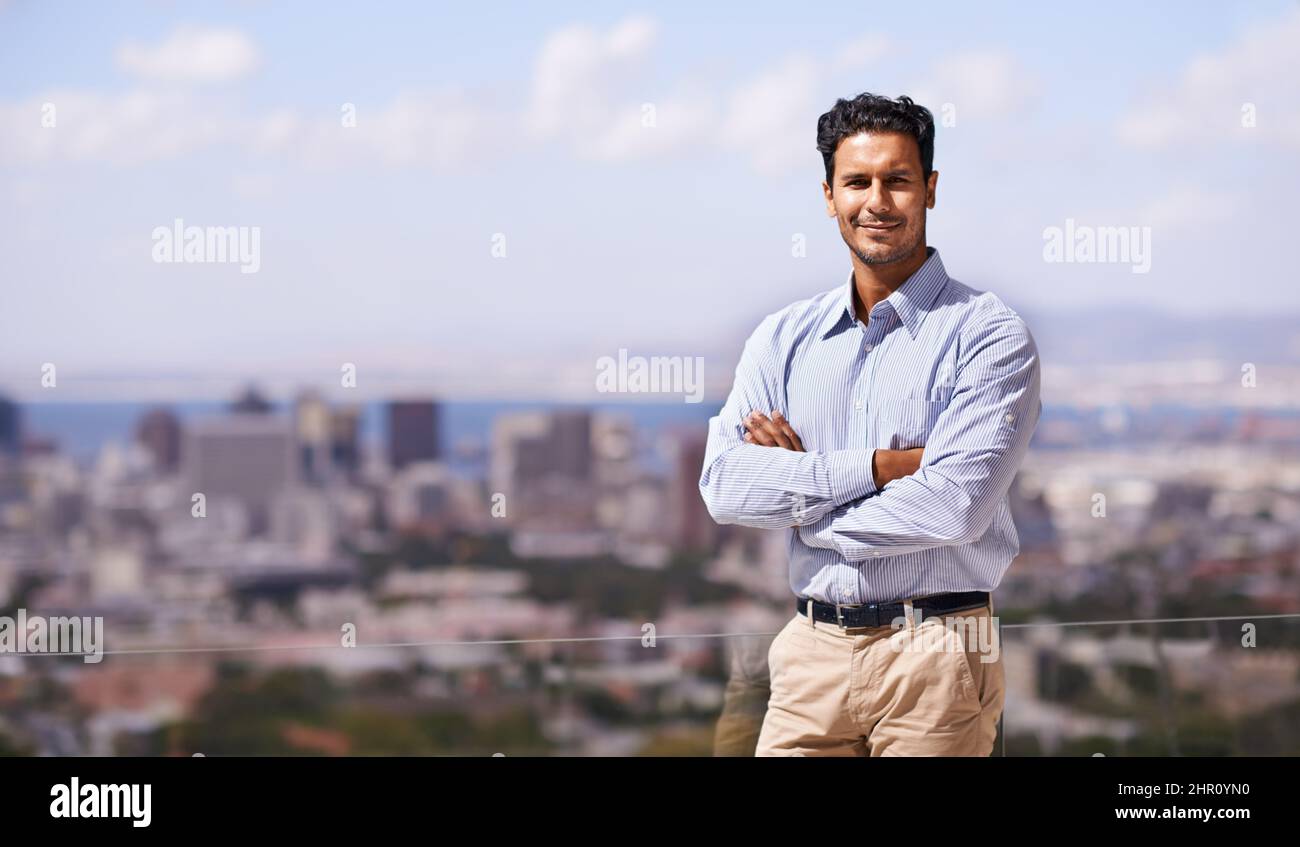 Hes got the city at his back. Portrait of a handsome young businessman ...