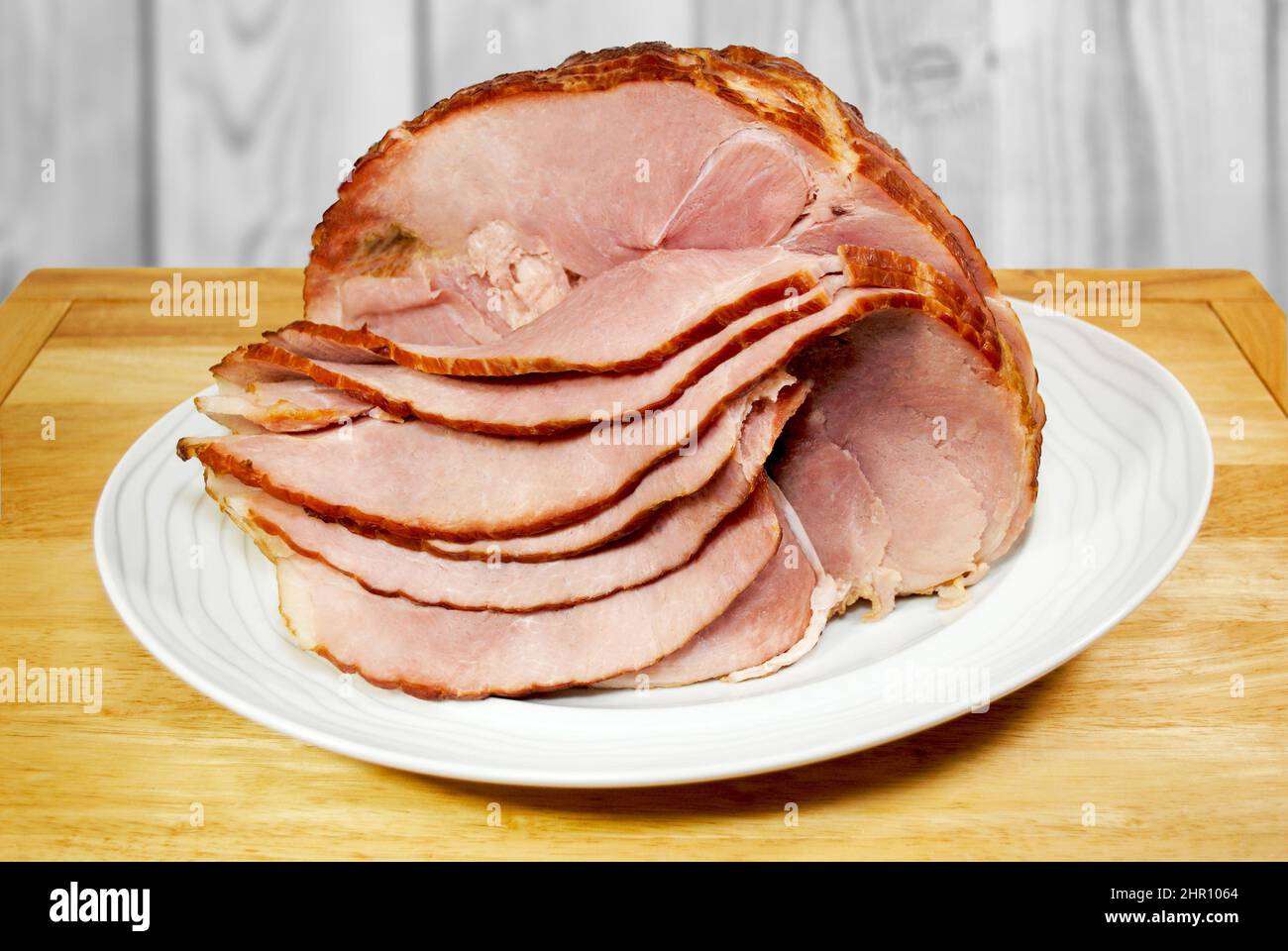 A Slow Baked Spiral Ham on a Serving Platter Stock Photo Alamy