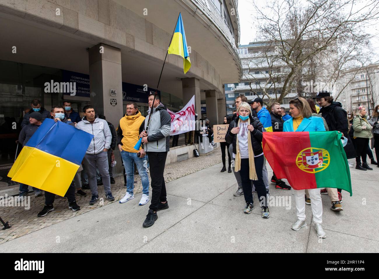 Lisbon, Portugal. 24th Feb, 2022. Protesters seen holding Ukrainian and Portuguese flag, during the demonstration.Hundreds of protesters, protested against the invasion of Ukraine in front of the Russian embassy in Portugal. Credit: SOPA Images Limited/Alamy Live News Stock Photo