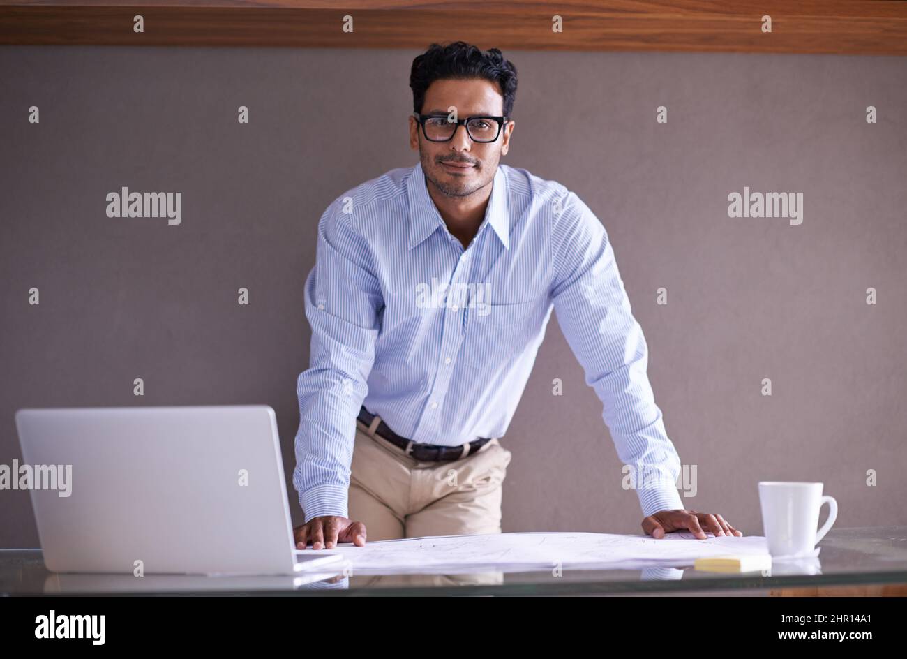 Hes ready for whatever the business world throws at him. Cropped shot of a handsome young businessman in his office. Stock Photo