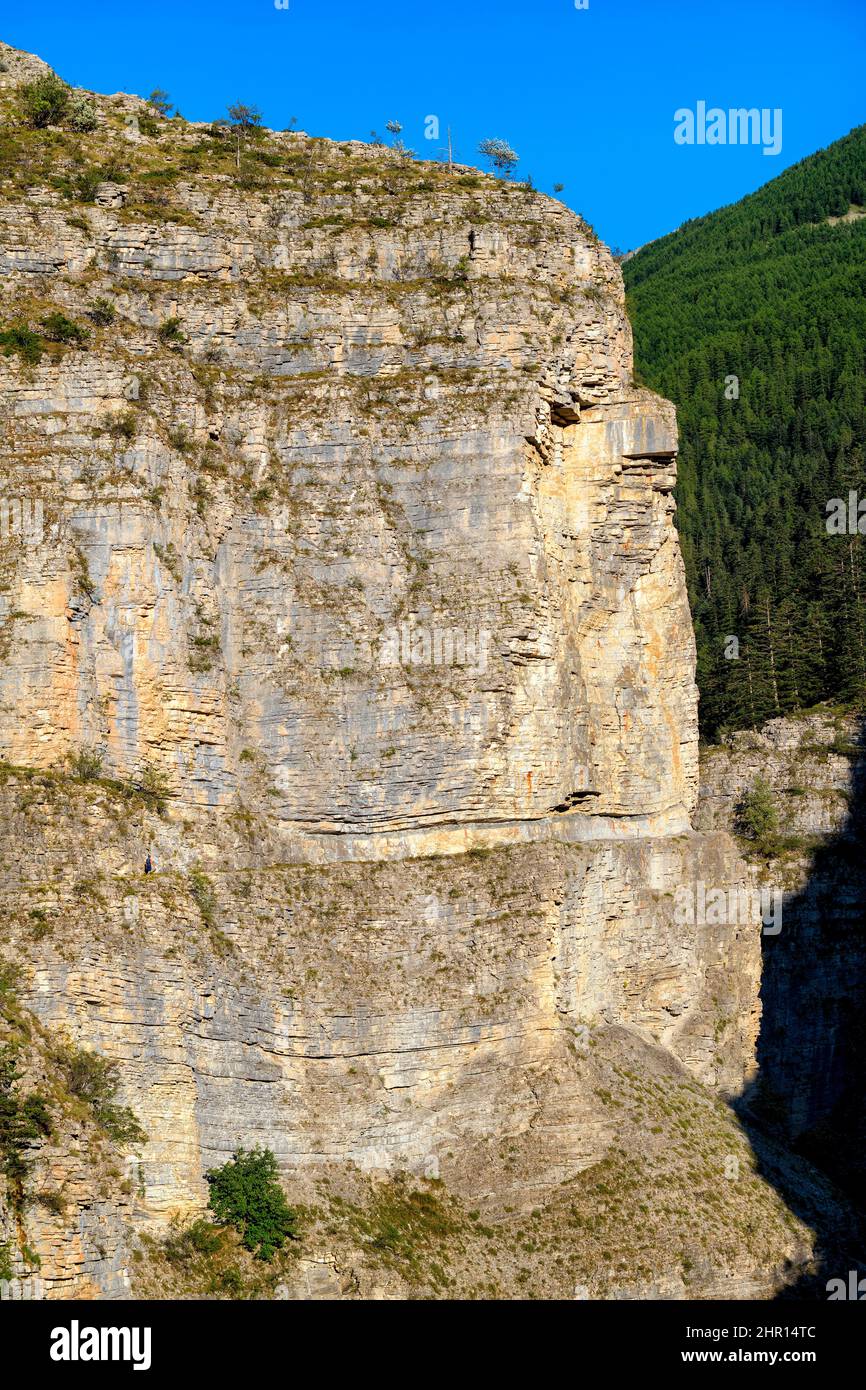 The Gorges de Saint Pierre, a splendid gorge carved in a thick horizontal series of cretaceous limestones - The walker on the horizontal path gives th Stock Photo