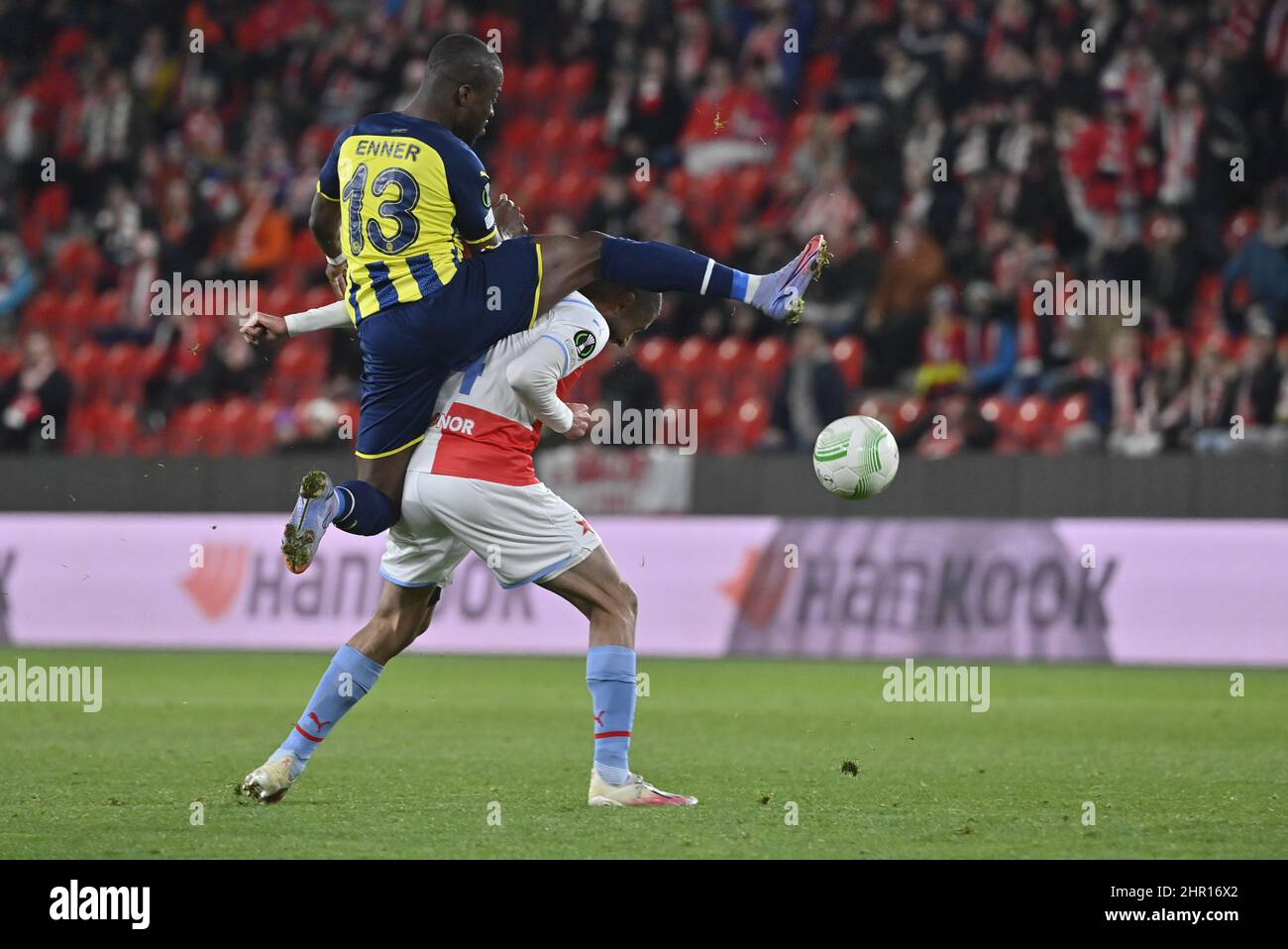 Prague, Czech Republic, Thursday. 24th Feb, 2022. Fenerbahce´s Enner Valencia, left, and Slavia´s Aiham Ousou in action during the Europa Conference League second round return match between Slavia Prague and Fenerbahce Istanbul in Prague, Czech Republic, Thursday Feb. 24, 2022. Credit: Vit Simanek/CTK Photo/Alamy Live News Stock Photo