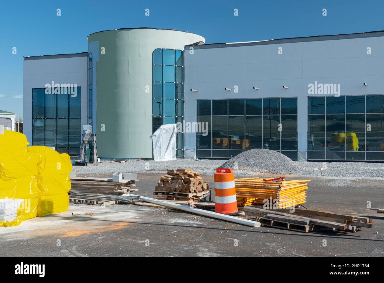 Horizontal shot of building supplies on hand at a commercial construction project. Stock Photo