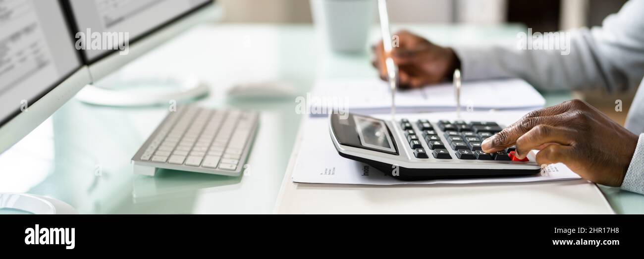 Bookkeeper Accountant Calculating Tax Invoice On Office Computer Stock ...