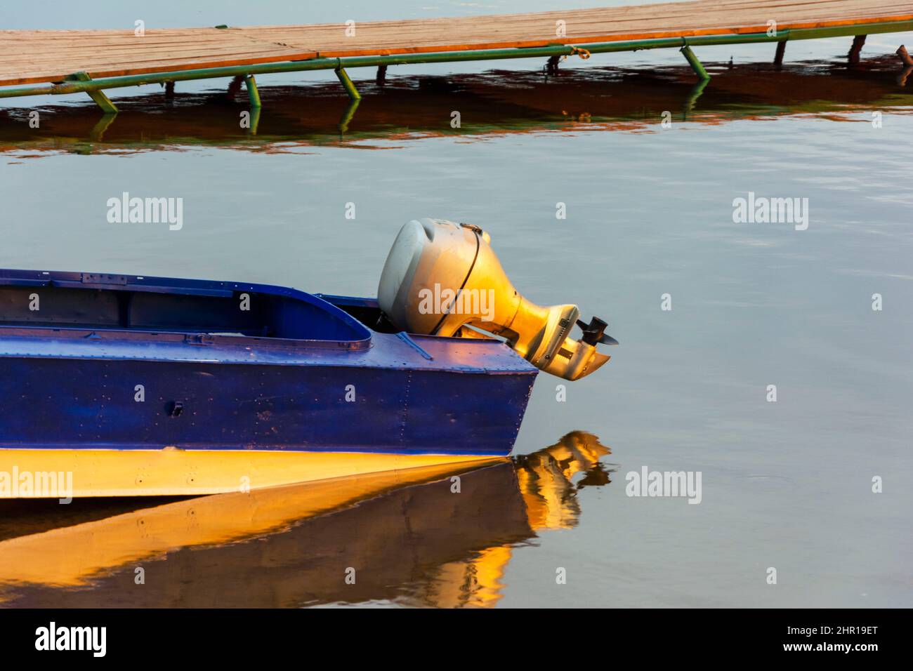 Outboard motor on a blue aluminum fishing boat, outboard motor on a