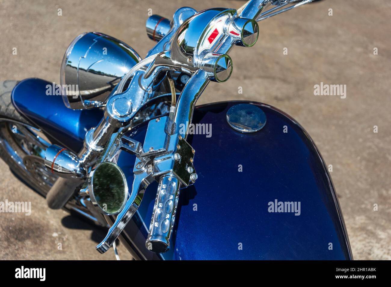 Beautiful top view of a motorcycle, blue motorcycle gas tank, motorcycle steering wheel, speedometer, Shining chrome, gas handle, Stylish motorcycle l Stock Photo