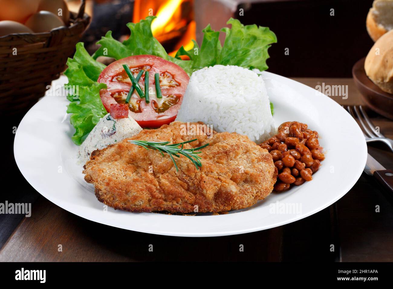 Breaded Steak with Rice and Beans Salad Stock Photo Alamy