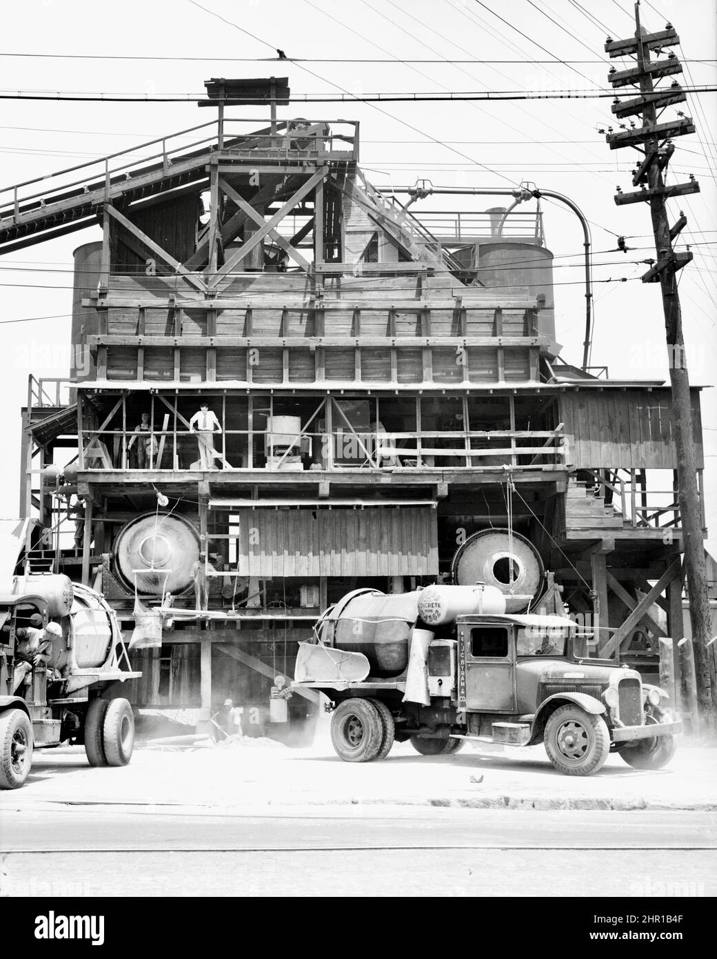 Dorothea Lange - Concrete mixing plant. Birmingham, Alabama, USA - 1936 Stock Photo