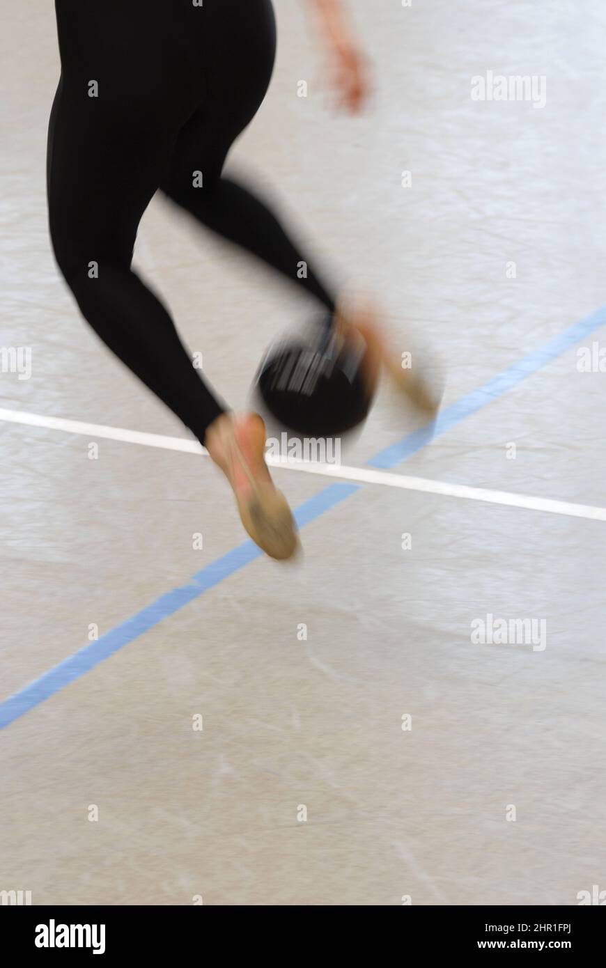 girl doing exercise with a gymnastic ball, rhythmic gymnastics Stock Photo