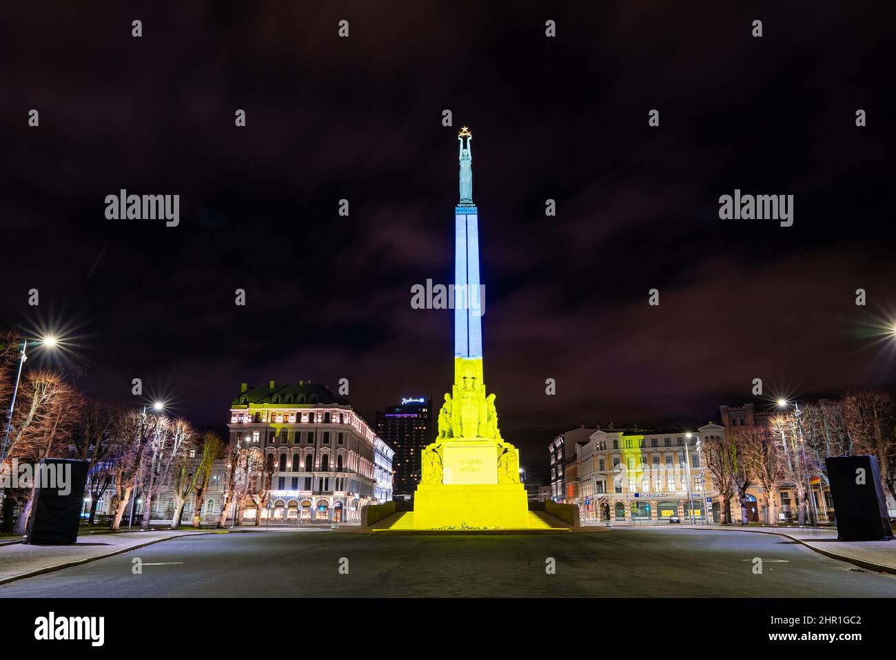 Latvian freedom monument - Milda in Ukranian colors. Support of Ukraine.  Stock Photo